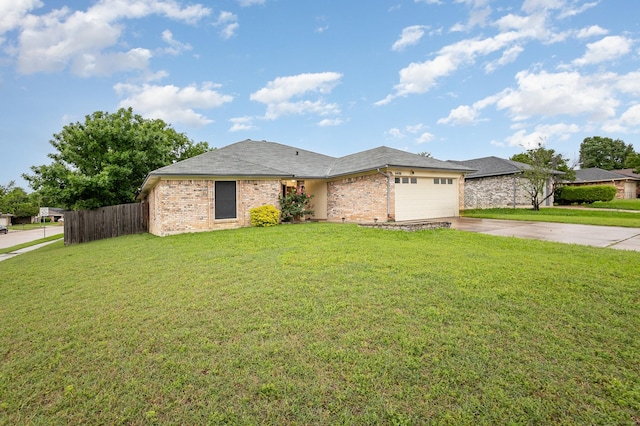 ranch-style house featuring fence, an attached garage, a front lawn, brick siding, and concrete driveway
