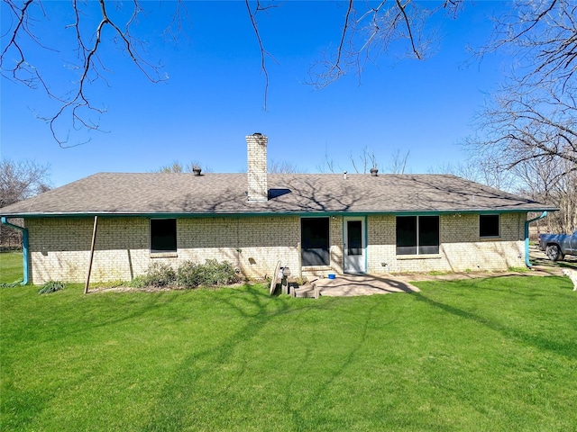 315 Low Water Rd, Grandview, TX 76050 - back of property featuring brick siding, a shingled roof, a yard, and a chimney