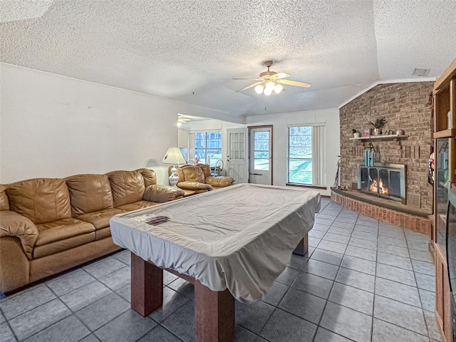 315 Low Water Rd, Grandview, TX 76050 - game room with a ceiling fan, a textured ceiling, vaulted ceiling, and tile patterned flooring