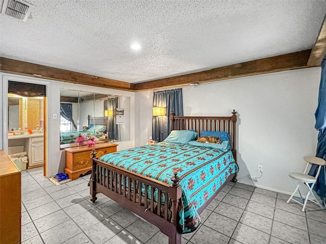 315 Low Water Rd, Grandview, TX 76050 - bedroom with light tile patterned floors, a textured ceiling, and visible vents