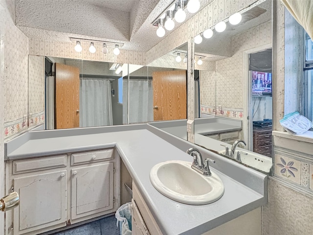 315 Low Water Rd, Grandview, TX 76050 - bathroom featuring vanity and wallpapered walls