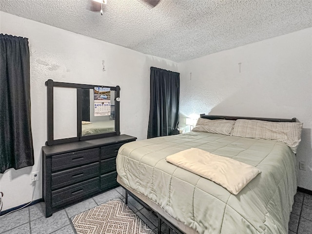 315 Low Water Rd, Grandview, TX 76050 - bedroom with a ceiling fan, a textured ceiling, and light tile patterned floors