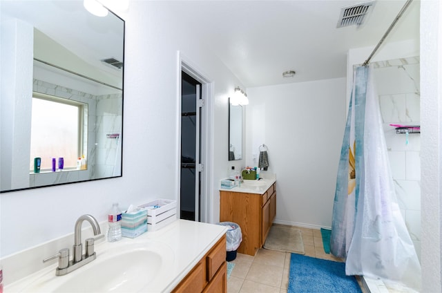105 Fossil Way, Alvarado, TX 76009 - bathroom with vanity, tile patterned floors, a shower with shower curtain, and a walk in closet