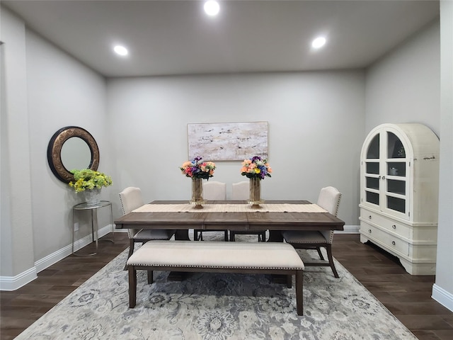 dining space with recessed lighting, baseboards, and dark wood finished floors