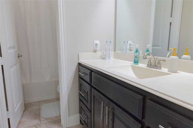full bath featuring vanity, tile patterned flooring, shower / bath combo, and toilet