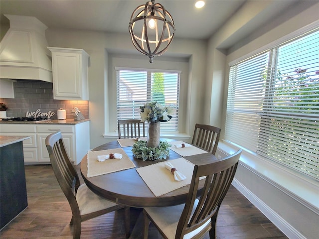 dining room featuring recessed lighting, baseboards, and dark wood finished floors