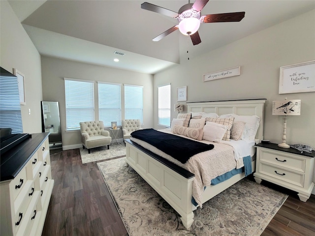 bedroom featuring a ceiling fan, visible vents, dark wood finished floors, baseboards, and recessed lighting