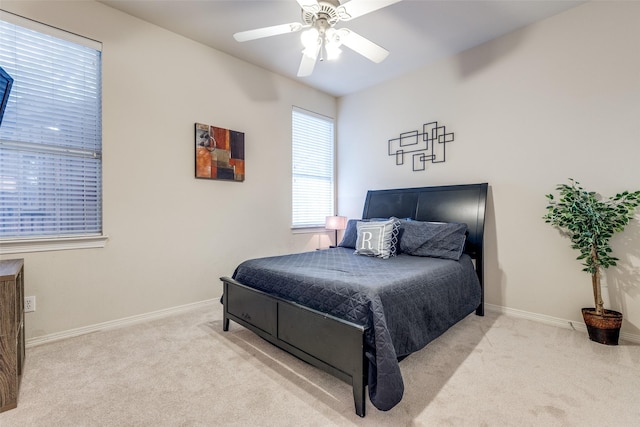bedroom featuring baseboards, ceiling fan, and carpet