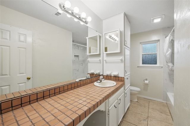 bathroom with toilet, tile patterned floors, visible vents, and vanity