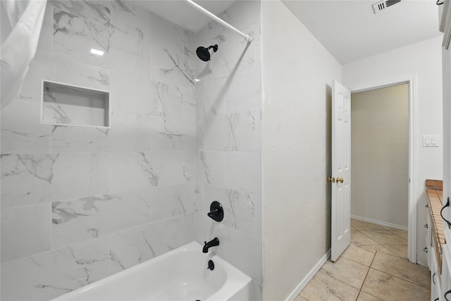 full bath featuring tub / shower combination, baseboards, and visible vents