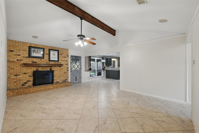 unfurnished living room with ceiling fan, lofted ceiling with beams, a fireplace, light tile patterned floors, and visible vents