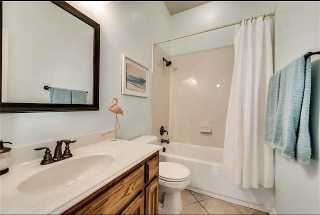 bathroom featuring tile patterned flooring, shower / bathtub combination with curtain, vanity, and toilet