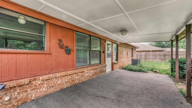 view of patio / terrace with central AC unit and fence