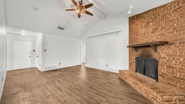 unfurnished living room featuring ceiling fan, visible vents, wood finished floors, and a fireplace