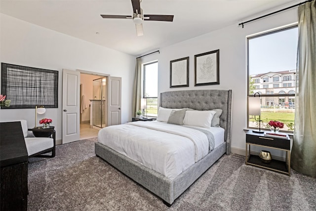 bedroom with baseboards, ceiling fan, ensuite bathroom, and carpet