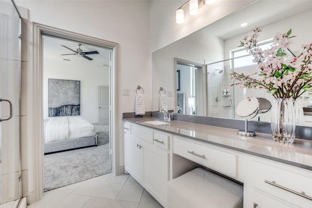 bathroom featuring tile patterned flooring, vanity, ensuite bathroom, ceiling fan, and a shower stall