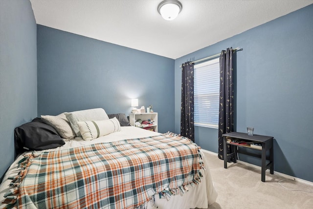 carpeted bedroom with baseboards