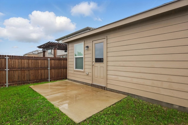 exterior space with fence and a patio area