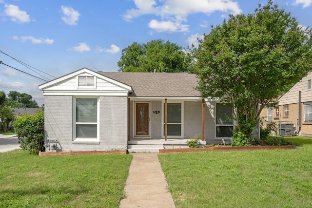 2653 Almeda Dr, Dallas, TX 75216 - ranch-style home featuring covered porch, brick siding, and a front lawn