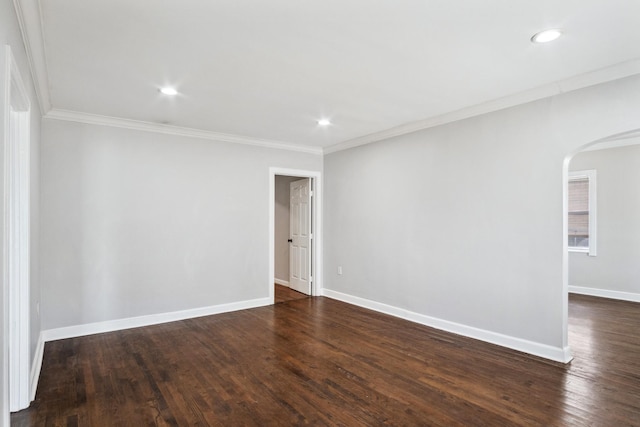 2653 Almeda Dr, Dallas, TX 75216 - empty room featuring arched walkways, crown molding, dark wood finished floors, baseboards, and recessed lighting