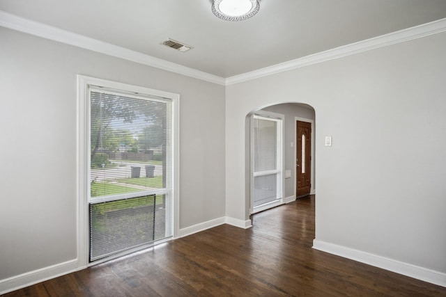 2653 Almeda Dr, Dallas, TX 75216 - unfurnished room with arched walkways, ornamental molding, baseboards, and wood finished floors