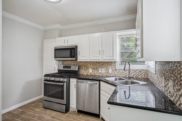 2653 Almeda Dr, Dallas, TX 75216 - kitchen with appliances with stainless steel finishes, a sink, white cabinetry, decorative backsplash, and light wood finished floors