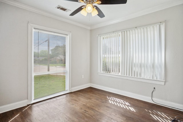 2653 Almeda Dr, Dallas, TX 75216 - spare room featuring healthy amount of natural light, dark wood-type flooring, baseboards, and ornamental molding