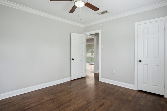 2653 Almeda Dr, Dallas, TX 75216 - unfurnished bedroom featuring ornamental molding, dark wood-type flooring, baseboards, and a ceiling fan