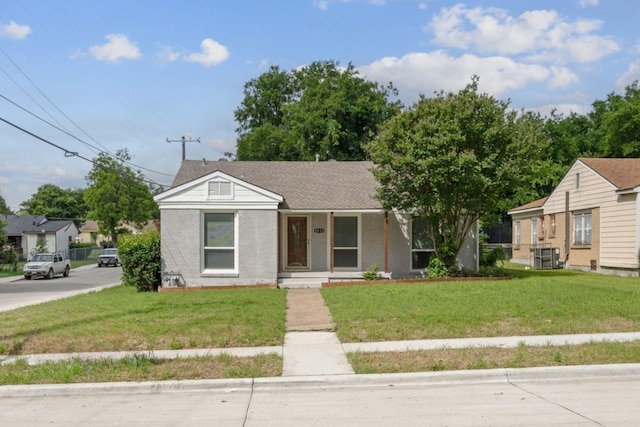 2653 Almeda Dr, Dallas, TX 75216 - view of front facade with a front lawn, a porch, and brick siding
