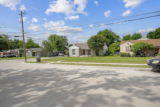 2653 Almeda Dr, Dallas, TX 75216 - view of property hidden behind natural elements featuring a residential view and a front lawn