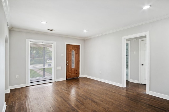 2653 Almeda Dr, Dallas, TX 75216 - foyer featuring crown molding, dark wood finished floors, baseboards, recessed lighting, and arched walkways