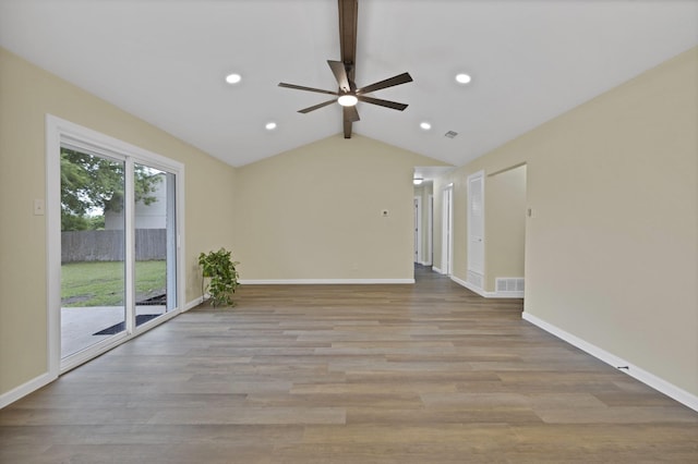 unfurnished living room with ceiling fan, lofted ceiling with beams, light wood-style flooring, baseboards, and visible vents