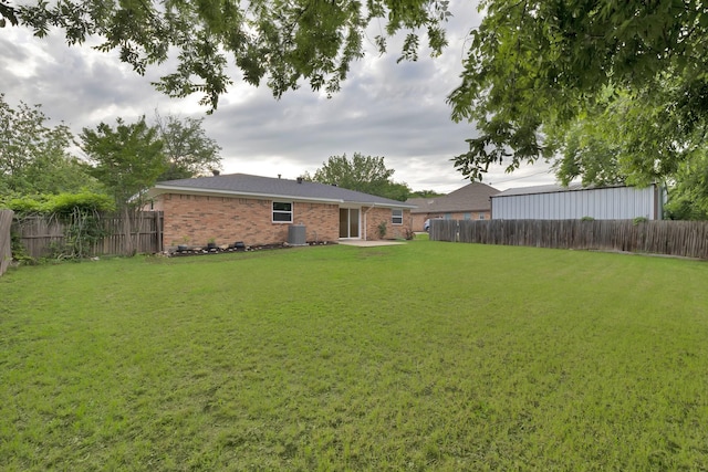 view of yard with a patio and a fenced backyard