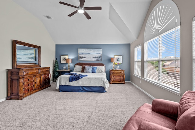 bedroom with lofted ceiling, baseboards, visible vents, and carpet