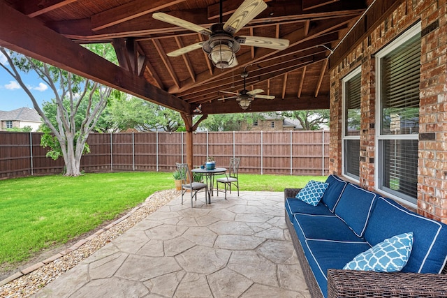view of patio / terrace with a fenced backyard, ceiling fan, and outdoor lounge area