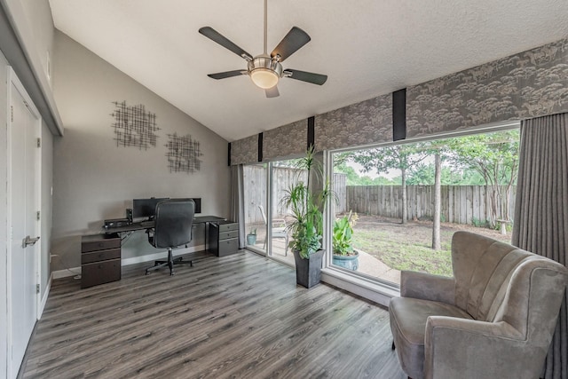 office featuring a ceiling fan, baseboards, wood finished floors, and high vaulted ceiling