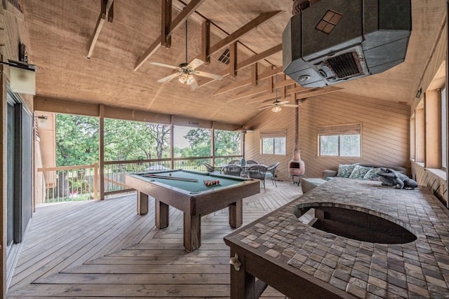 playroom with a ceiling fan, billiards, lofted ceiling, and wooden walls