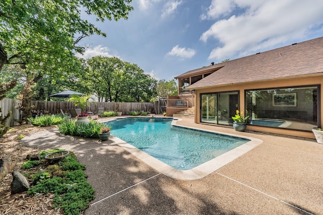 view of pool with a fenced in pool, a fenced backyard, a patio area, and stairway