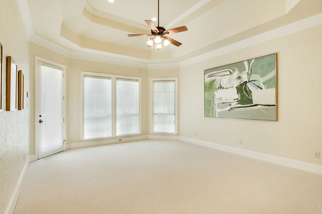 1713 Broadmoor Dr, Keller, TX 76262 - carpeted spare room with a tray ceiling, a ceiling fan, and ornamental molding