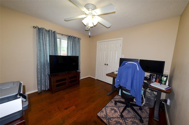 office area featuring baseboards, ceiling fan, and wood finished floors
