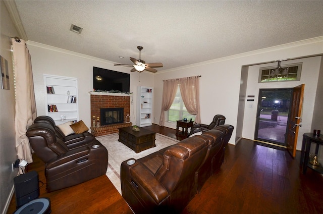 living area featuring crown molding, ceiling fan, a textured ceiling, and wood finished floors