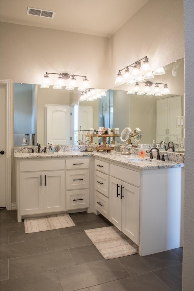 full bath with vanity, tile patterned floors, and visible vents