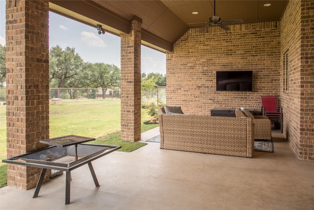 view of patio featuring ceiling fan, fence, and an outdoor hangout area
