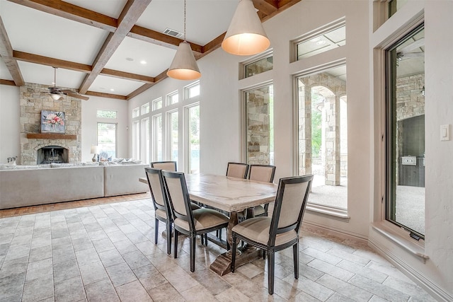 1342 Steeple Chase Ln, Aledo, TX 76008 - dining area featuring ceiling fan, a stone fireplace, beamed ceiling, visible vents, and coffered ceiling