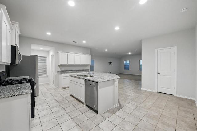 624 Whitecomb Ln, Justin, TX 76247 - kitchen with white cabinets, a sink, stainless steel appliances, recessed lighting, and light tile patterned floors