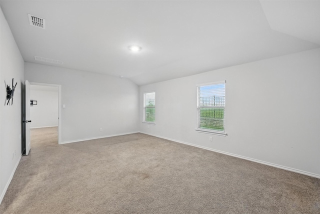624 Whitecomb Ln, Justin, TX 76247 - spare room featuring carpet floors, baseboards, visible vents, and vaulted ceiling
