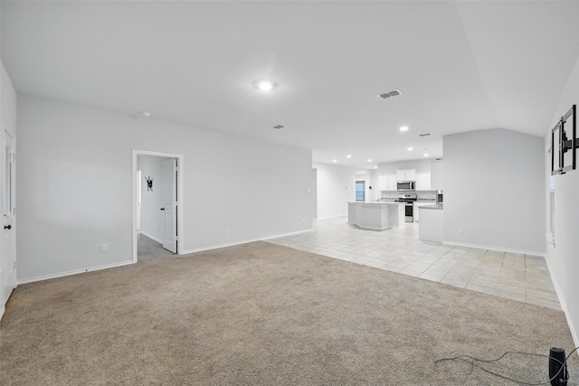 624 Whitecomb Ln, Justin, TX 76247 - unfurnished living room featuring light colored carpet, baseboards, visible vents, and light tile patterned floors