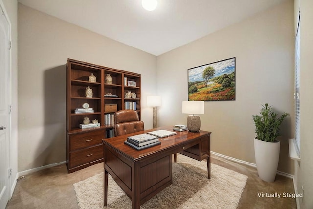 home office with light colored carpet and baseboards