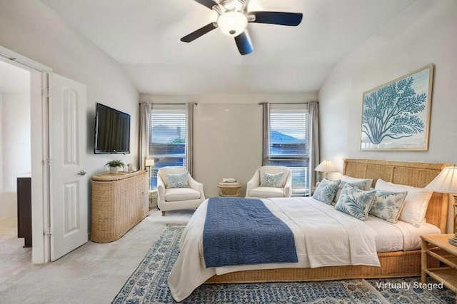 bedroom featuring ceiling fan, light carpet, and lofted ceiling