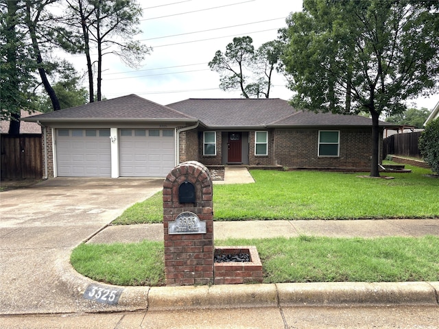 single story home with driveway, roof with shingles, fence, a front lawn, and an attached garage